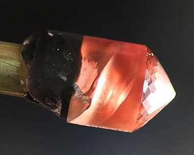 Schiller Oregon Sunstone on Dop, rough from Dust Devil Mine